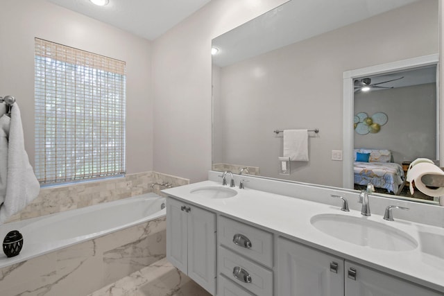 bathroom featuring a sink, double vanity, connected bathroom, and a bath