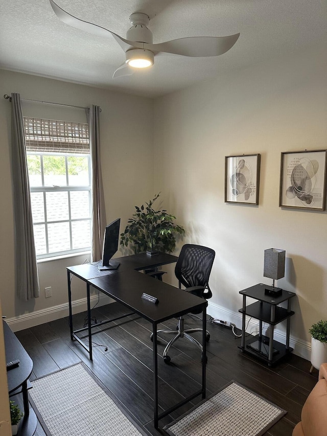 office with ceiling fan, dark wood finished floors, and baseboards