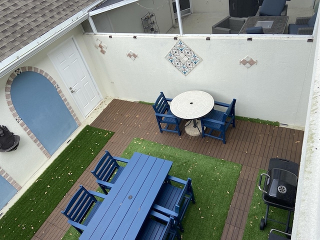 wooden terrace featuring outdoor dining space