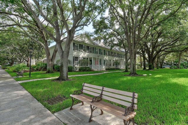 view of community featuring a yard