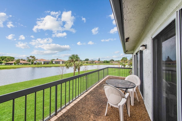 balcony featuring a water view