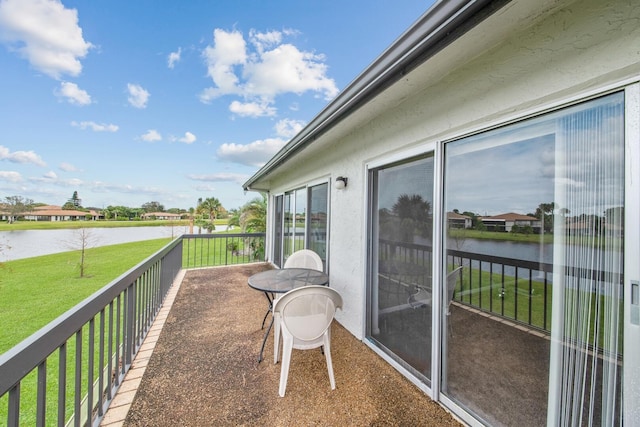 balcony featuring a water view