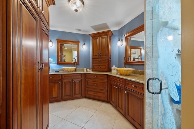 bathroom featuring vanity, tile patterned floors, an enclosed shower, and ornamental molding