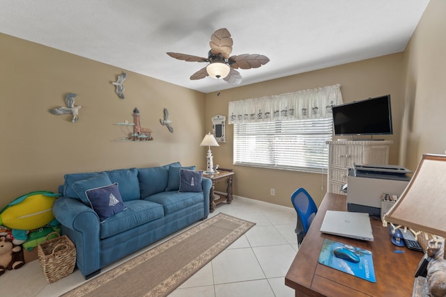 tiled home office featuring ceiling fan