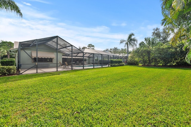 view of yard featuring a patio and a lanai