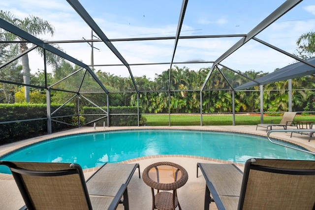 view of pool featuring a lanai and a patio area