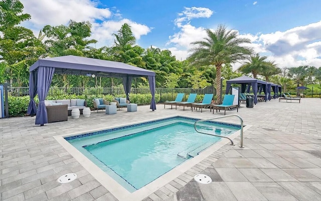 view of pool featuring a gazebo, outdoor lounge area, and a patio