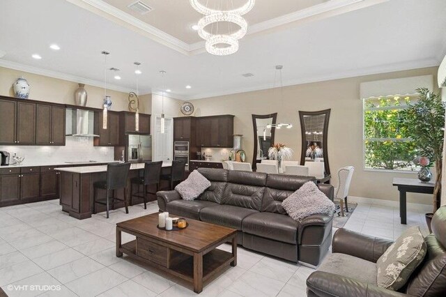 living room featuring light tile patterned flooring, a chandelier, french doors, and ornamental molding