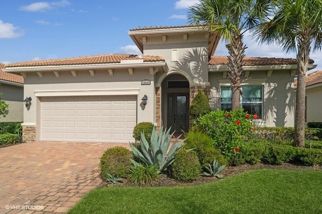 mediterranean / spanish-style home with a garage