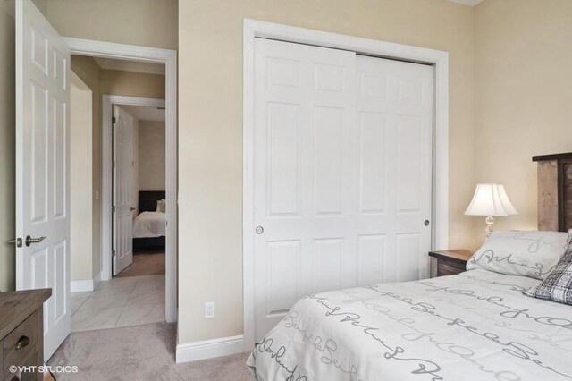 carpeted bedroom with a closet