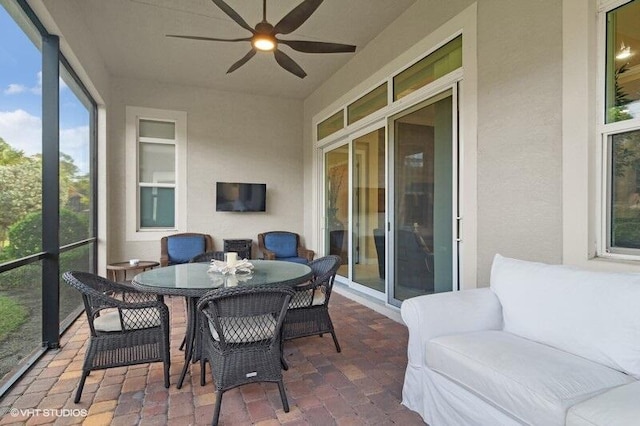 sunroom / solarium with ceiling fan