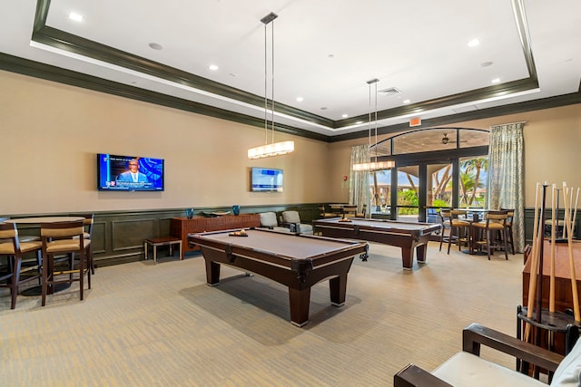 recreation room with ornamental molding, a tray ceiling, light colored carpet, billiards, and french doors