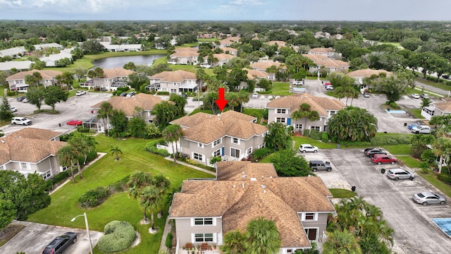 aerial view featuring a water view and a residential view