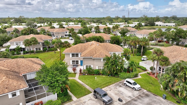 birds eye view of property with a residential view