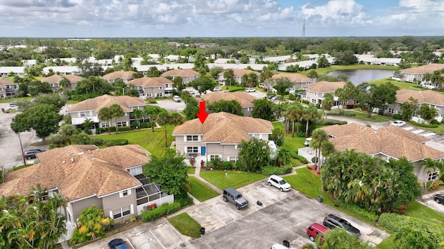 aerial view with a residential view and a water view