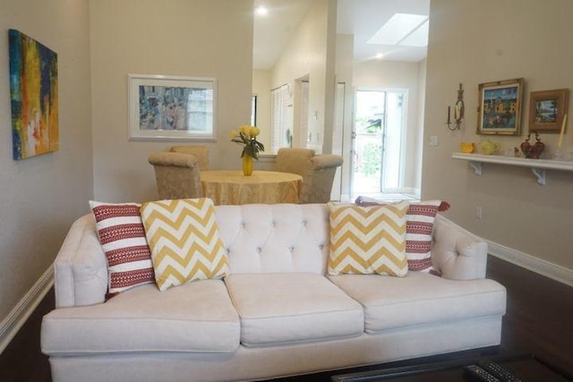 living room featuring vaulted ceiling