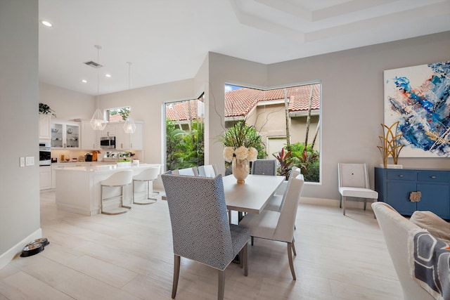 dining space with light wood-type flooring