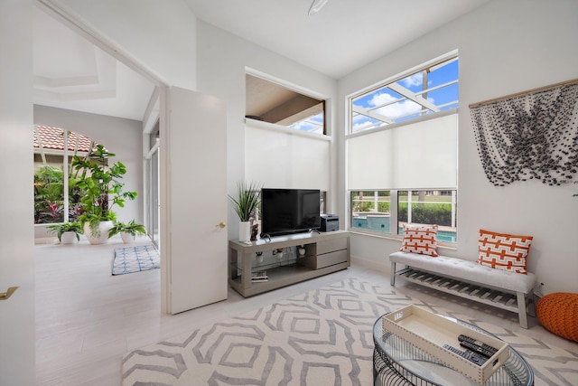 living room with a towering ceiling