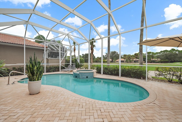 view of swimming pool featuring an in ground hot tub, a patio area, and a lanai