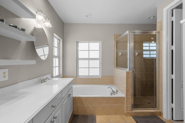 bathroom with vanity, shower with separate bathtub, plenty of natural light, and tile patterned flooring