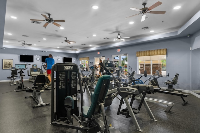 gym with a raised ceiling