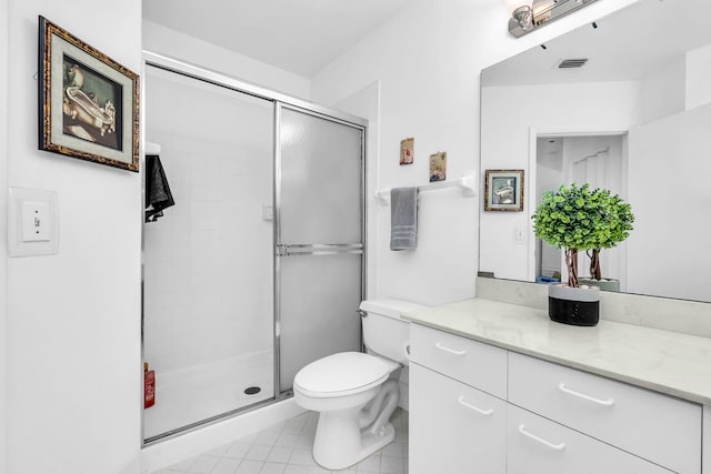 bathroom with toilet, walk in shower, and vanity