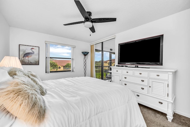 bedroom featuring dark colored carpet, access to outside, a textured ceiling, and ceiling fan