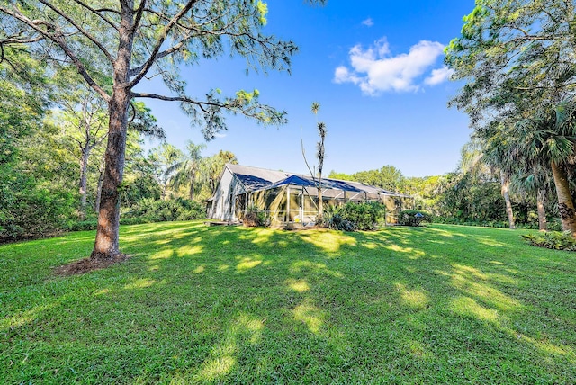 view of yard with a lanai