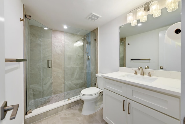 bathroom featuring vanity, a shower with door, and toilet