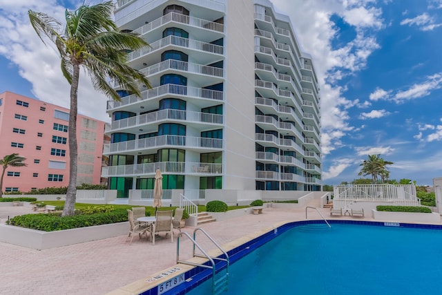 view of pool featuring a patio area