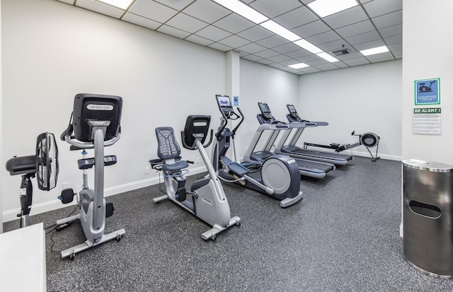 workout area featuring a paneled ceiling