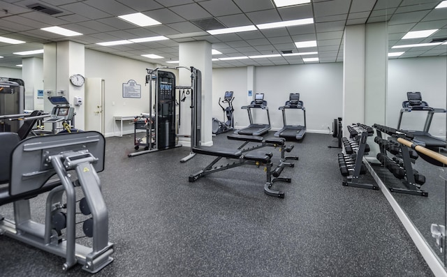 workout area featuring a paneled ceiling