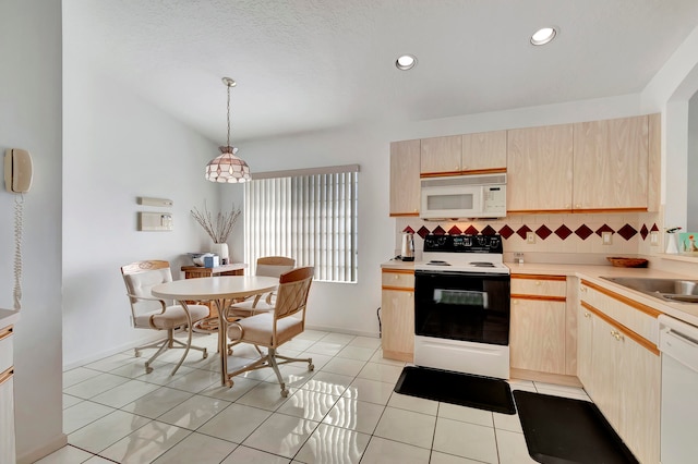 kitchen with light brown cabinets, backsplash, pendant lighting, and white appliances