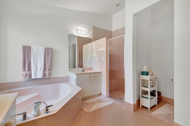 bathroom with vanity, plus walk in shower, and tile patterned floors