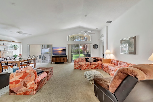 living room featuring ceiling fan, light carpet, and a wealth of natural light