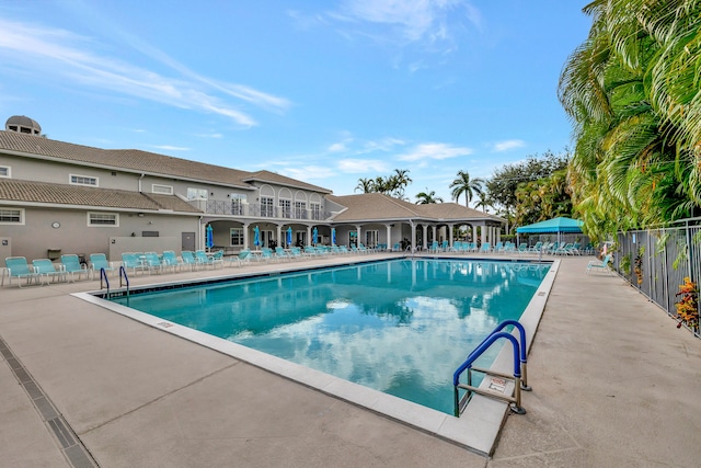 view of swimming pool with a patio