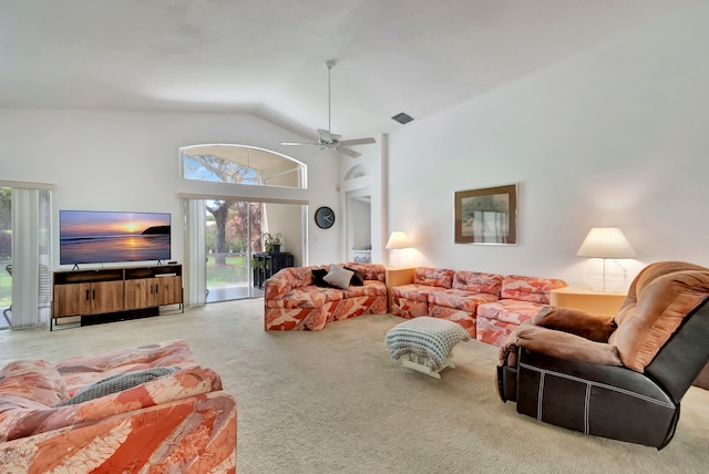 carpeted living room featuring ceiling fan and high vaulted ceiling