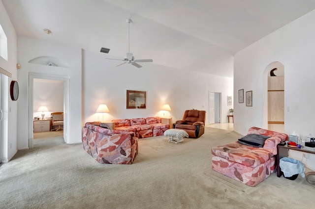 living room featuring light carpet, high vaulted ceiling, and ceiling fan