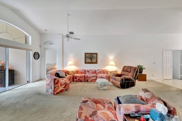 carpeted living room featuring high vaulted ceiling and ceiling fan