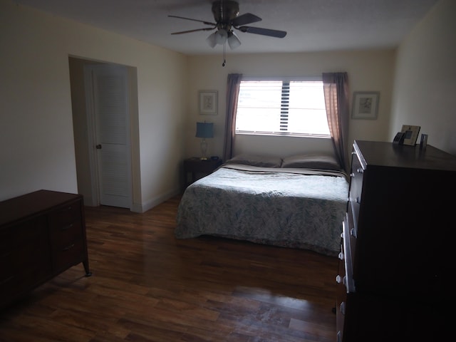 bedroom featuring dark hardwood / wood-style flooring and ceiling fan