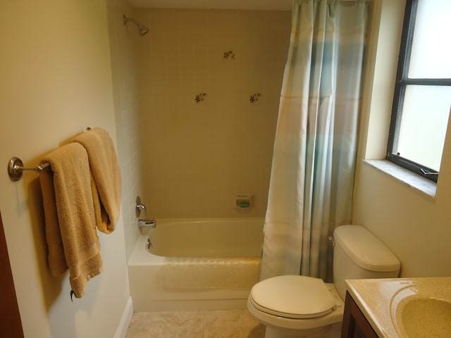 full bathroom with shower / bath combo with shower curtain, tile patterned flooring, vanity, and toilet