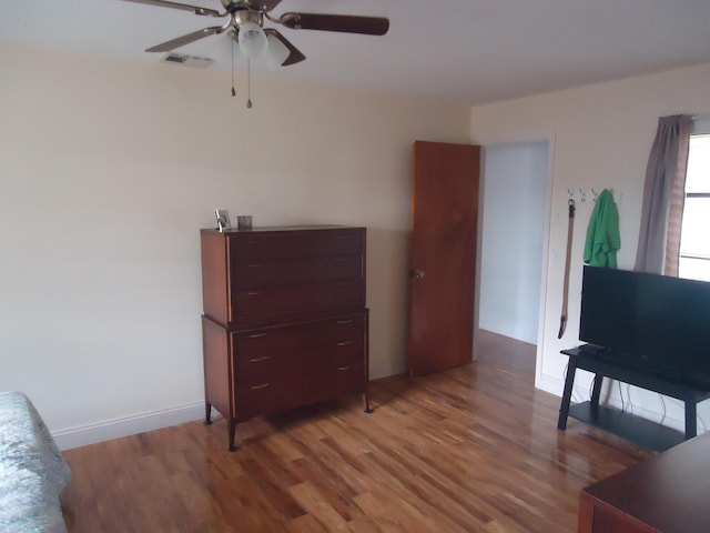 interior space featuring hardwood / wood-style flooring and ceiling fan