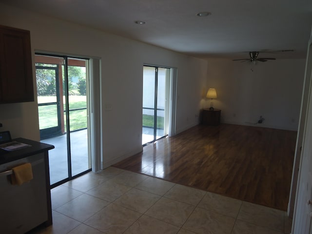 unfurnished room featuring light hardwood / wood-style floors and ceiling fan