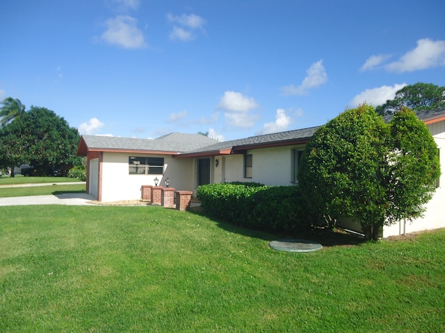 ranch-style home featuring a front yard