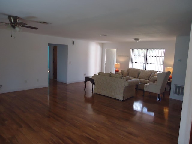 living room with ceiling fan and dark hardwood / wood-style floors