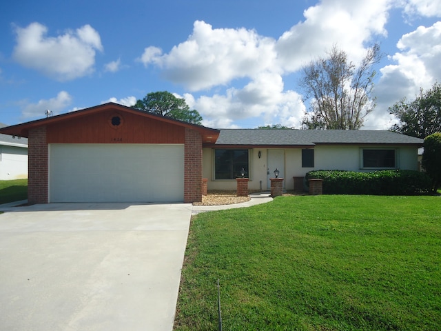 ranch-style home with a garage and a front lawn