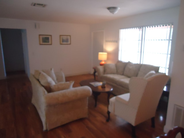 living room with dark hardwood / wood-style floors