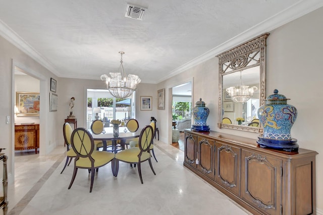 dining space featuring crown molding and a chandelier