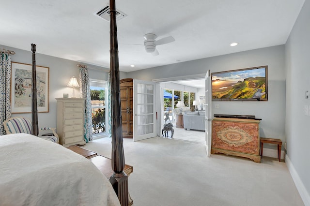 bedroom with french doors, ceiling fan, light carpet, and access to exterior