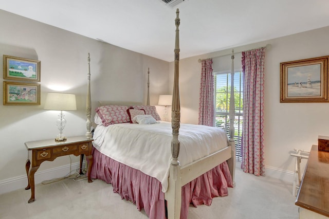 bedroom with light colored carpet